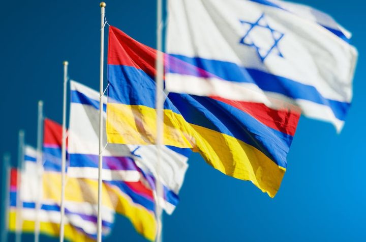 armenia-and-israel-flags-against-blue-sky