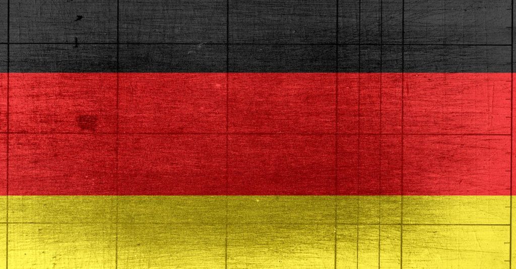 grungy-background-designed-as-flag-of-germany-on-shabby-wooden-board-with-measure-scale-1