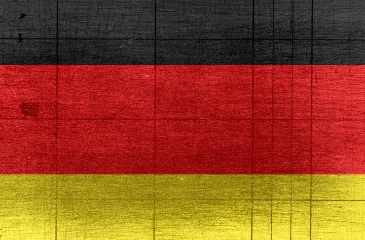 grungy-background-designed-as-flag-of-germany-on-shabby-wooden-board-with-measure-scale-1