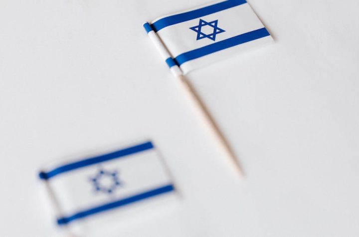 israel-miniature-flag-on-white-surface