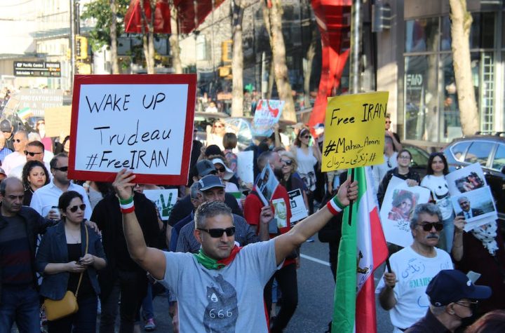 protesters-walking-on-street-holding-placards